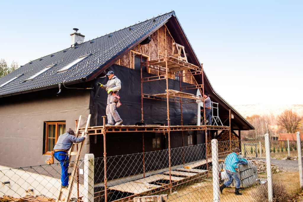 graphicstock construction workers standing on scaffold thermally insulating house facade with glass wool and black foil Huu ONrfW