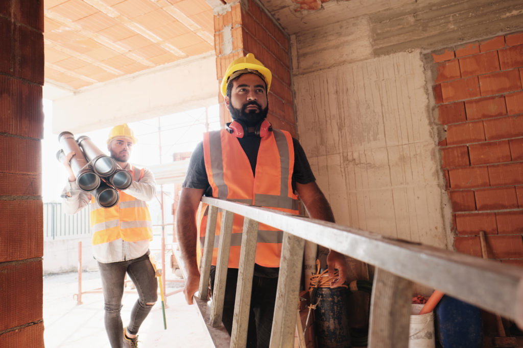storyblocks people working in construction site men at work in new house inside apartment building team of professional workers using tools and equipment HHRMaJhlV